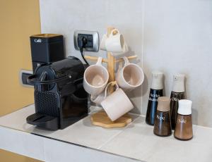 Příslušenství pro přípravu čaje a kávy v ubytování Bergamo Luxury apartment - Orange Blossom