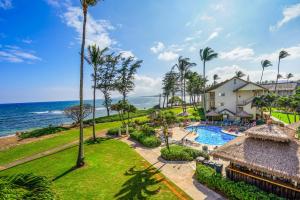 an aerial view of a resort with a swimming pool and the ocean at Islander on the Beach 370 in Kapaa