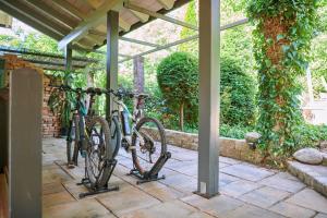 a group of bikes parked under a building at ÜbermAlztal Suite in Altenmarkt an der Alz