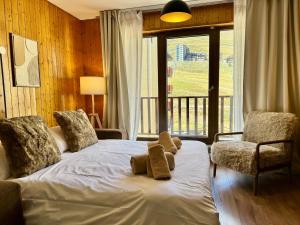 Ένα ή περισσότερα κρεβάτια σε δωμάτιο στο Acogedor Estudio en Pas de la Casa a pie de pistas