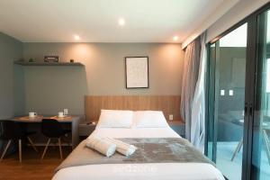 Ένα ή περισσότερα κρεβάτια σε δωμάτιο στο Prédio à beira-mar c/ Piscina e academia - ARUs +28 φωτογραφίες