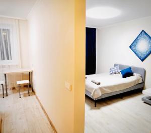 a bedroom with a bed and a room with a table at M&M Apartment V SELF CHECK-IN in Panevėžys