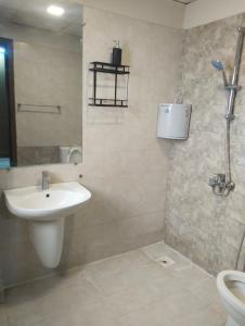 a bathroom with a sink and a shower and a toilet at Afzal real estate builder's in Islamabad