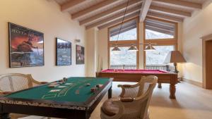 a room with a poker table and a pool table at Entrebin PremiumChalet AO in Aosta