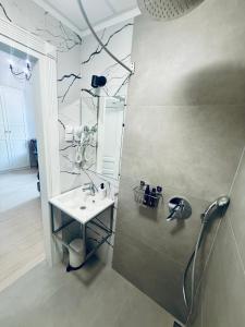 a bathroom with a shower and a sink at Apartamenty PREMIUM Rynek 21 in Toruń +73 photos