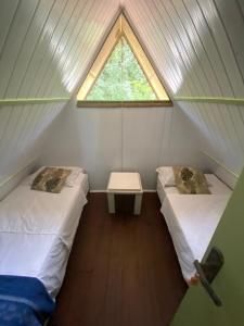 Postel nebo postele na pokoji v ubytování Chale Hostel Do Indio