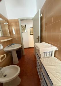a bathroom with a sink and a toilet at villa De Simone in Campomarino +38 photos