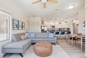 a living room with a couch and a table at Panorama View - Mountain Views - Community Pool in Fountain Hills