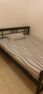 Postel nebo postele na pokoji v ubytování Elite Bookings Happy Homes And NJUFFA Enterprise