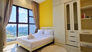 a bedroom with a bed and a large window at Trion Sky Suite KL in Kuala Lumpur +49 photos