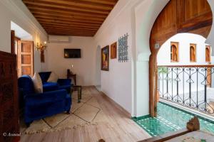 a house with a pool in the middle of a room at Dar Chama in Chefchaouene