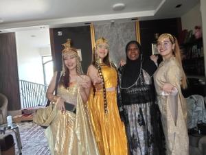 a group of women dressed up in gowns posing for a picture at Summer Land Hotel in Abu Simbel