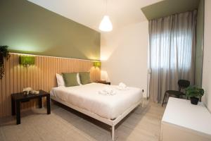 a hotel room with a bed and a table at Porto Panorama by Sira Stays in Porto