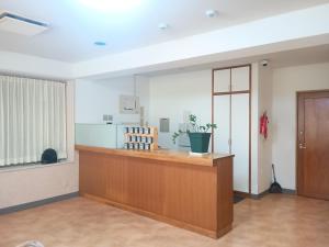 an empty waiting area in a hospital emergency room at Hotel-澄Sumi in Naha