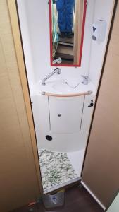 a bathroom with a sink and a mirror at Catamaran Jaso in Jadranovo