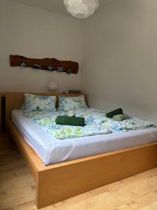 a bed with two pillows on it in a bedroom at Ferienwohnung Held in Obertraun