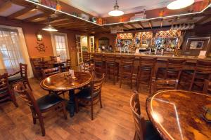 a restaurant with wooden tables and chairs and a bar at Fulton Steamboat Inn in Lancaster +23 photos