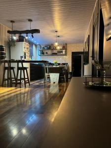 a kitchen with a table and a dining room at Pool amid the green in Gaspar +31 photos