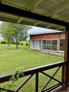 a view of a building from a porch at Lomas Del Delta in Esquina +12 photos