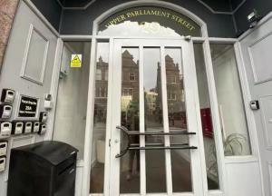 a front door of a building with a sign on it at Modern Studio, Top Floor, King Street Views in Nottingham