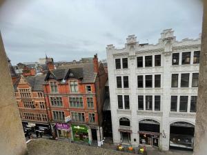 a group of buildings on a city street at Modern Studio, Top Floor, King Street Views in Nottingham +11 photos