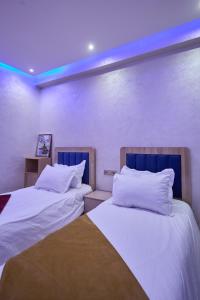 Ένα ή περισσότερα κρεβάτια σε δωμάτιο στο Appartement l'aéroport