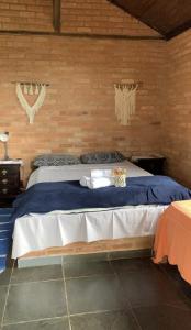 Postel nebo postele na pokoji v ubytování Chalés Itaoka Belvedere