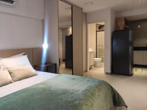 Postel nebo postele na pokoji v ubytování Estúdio completo e charmoso