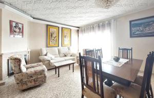 a living room with a table and a couch at Casa Traiguera in Traiguera