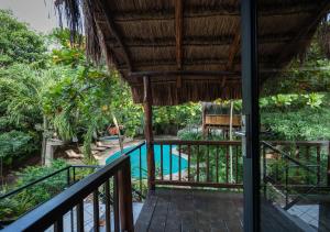 a view from the balcony of a resort with a swimming pool at Na Balam Hotel in Isla Mujeres