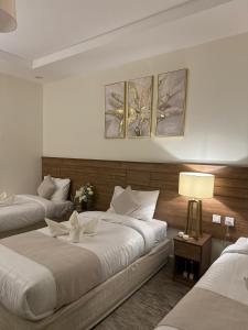 Ένα ή περισσότερα κρεβάτια σε δωμάτιο στο Oriens Shishah