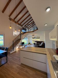 a kitchen and living room with a vaulted ceiling at Villa Marija in Livno