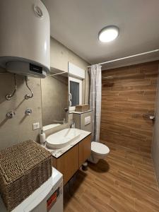 a bathroom with a sink and a toilet at Villa Marija in Livno