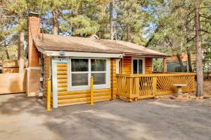 a small yellow house with a porch and a window at Sugar Bear Chalet #2559 in Sugarloaf