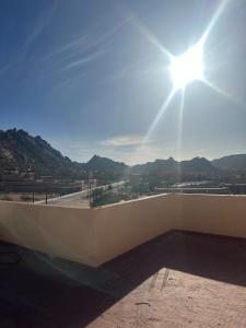 a view from the roof of a building with the sun at Bright Self-Catering 2 bedroom Apartment in Tafraout in Tafraoute