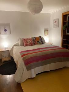 En eller flere senge i et værelse på Casita Equipada Cerro Bellavista