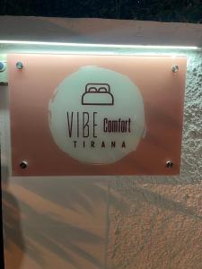 a sign that reads viele comfort tramania at Vibe Comfort Tirana in Tirana