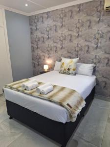 Postel nebo postele na pokoji v ubytování Oban Guesthouse Durban