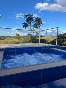 a jacuzzi tub with a view of a tree at Villa Verde in Popayan