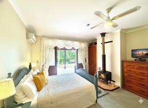 a bedroom with a bed and a fireplace at Montville Boutique BnB in Montville +21 photos