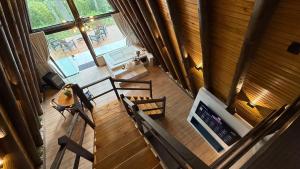 an overhead view of a living room with a table and chairs at Vistas de Mantiqueira in Bom Jardim da Serra