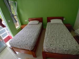 Ένα ή περισσότερα κρεβάτια σε δωμάτιο στο Residencial Chez Flávia