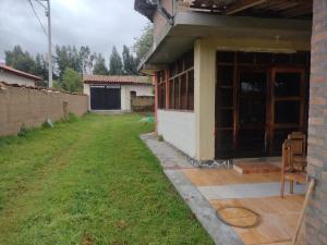 a view of a house with a yard at Cozy Rural House in Apata - Jauja 