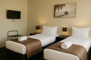 Postel nebo postele na pokoji v ubytování The Post Hotel