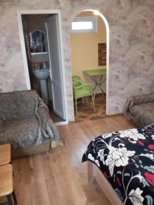 a bedroom with a bed and a table in a room at Name in Tʼelavi