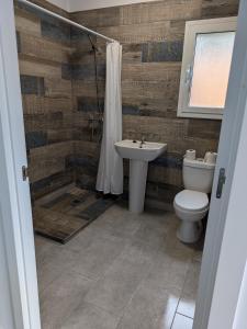 a bathroom with a toilet and a sink at Can Altaba in Maçanet de la Selva +13 photos