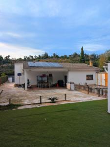a house with solar panels on the roof at Can Altaba in Maçanet de la Selva