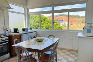 a kitchen with a table with a bowl on it at Casa Vale de Água em Santarém in Santarém