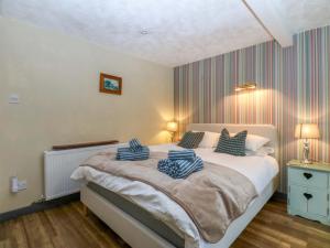 Postel nebo postele na pokoji v ubytování Hafod