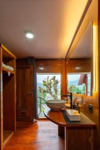 a kitchen with a bowl on a table with a window at Pondanu Living in Bedugul +101 photos